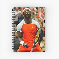 Frances Tiafoe gives a spiral notebook