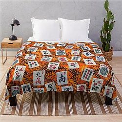 Mahjong tiles on orange butterfly pattern throw blanket