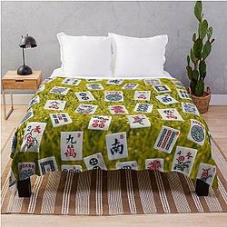 Mahjong tiles on green grass background Throw Blanket