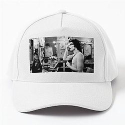 Tim Curry of the Rocky Horror Cast wearing a Baseball Cap