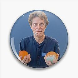 Willem Dafoe Holding a Moldy Orange Pin