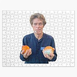 Willem Dafoe Holding a Moldy Orange Jigsaw Puzzle