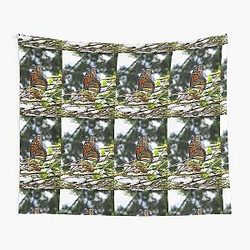 Monarch butterfly flying in search of sun By Yannis Lobaina Tapestry