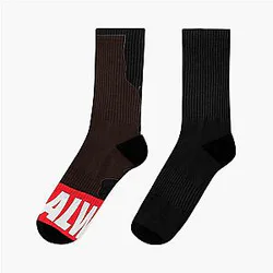 Alan Rickman wears black and red socks
