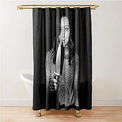 Aubrey Plaza holding knife with black and white shower curtain