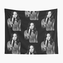 Aubrey Plaza holding tapestry