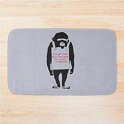 Banksy Quote Monkey Chimpanzee Laugh Now but one day we'll be in charge Graffiti Street art with Banksy signature tag and funny red stripes Bath Mat