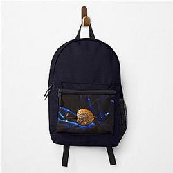 Golden seed pod on blue velvet backpack