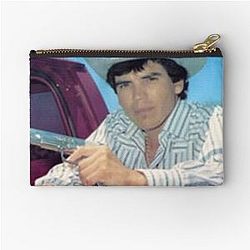 Chalino Sanchez holding a gun