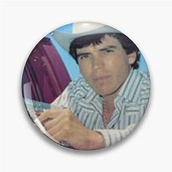 Chalino Sanchez holding a gun