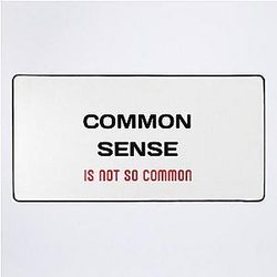 Common sense is rare these days Desk Mat