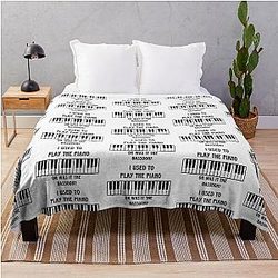 Friday night dinner with goodman playing the piano under a throw blanket