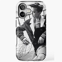 G-Dragon pose with signature iPhone case