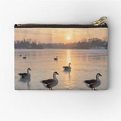 Geese on a frozen lake Zipper Pouch