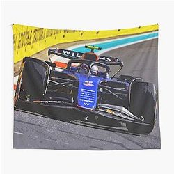 Logan Sargeant racing his 2024 F1 race car during the Miami Grand Prix