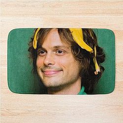Matthew Gray Gubler with a banana bath mat