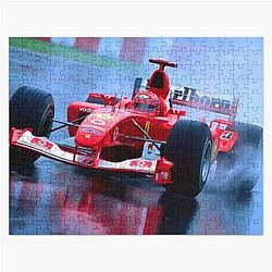 Michael Schumacher racing in his 2003 F1 race car in the rain Jigsaw Puzzle
