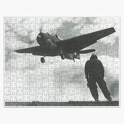 A Landing Signal Officer watches as a TBF-1 Avenger traps aboard the aircraft carrier USS Wolverine on Lake Michigan in 1943.