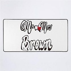 Mr and Mrs Brown Personalised wedding anniversary desk mat. Romantic White cursive text on black background with love heart.