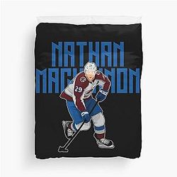 Nathan MacKinnon plays the puck 29 Duvet Cover