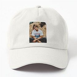 River Phoenix with his dog wearing a dad hat.