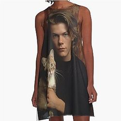 River Phoenix with his pet cat in an A-line dress