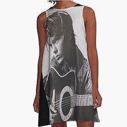 RIVER PHOENIX PLAYING THE GUITAR WITH MELANCHOLIC DRESS
