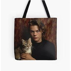 River Phoenix with his pet cat Tote Bag