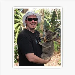 Shane Gillis holds a koala sticker