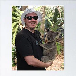 Shane Gillis holds a koala