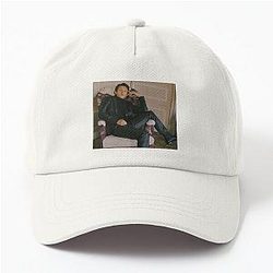 Portrait Tom Holland Sitting in a Chair wearing a Dad Hat